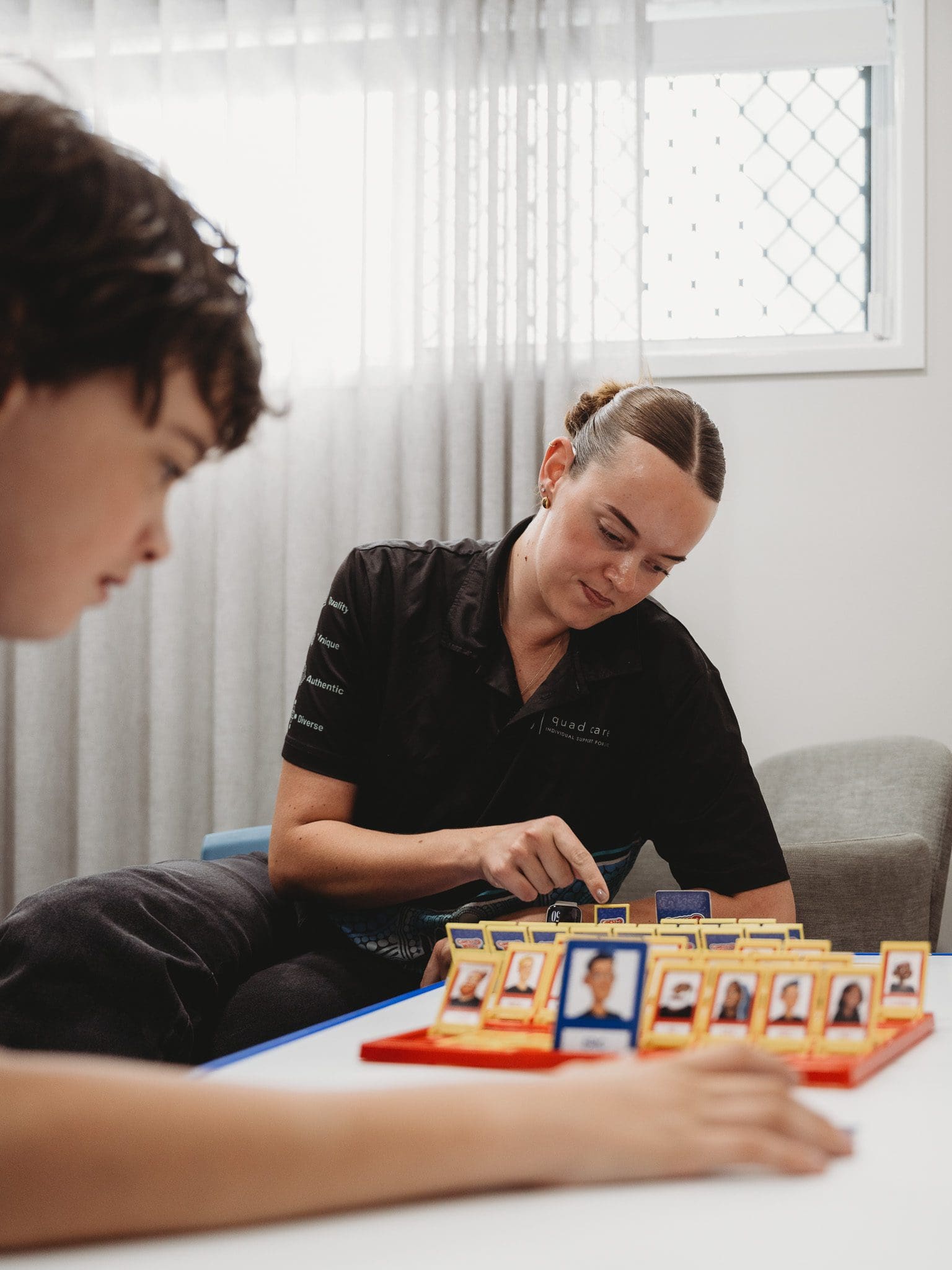 Positive behaviour practitioner with her client